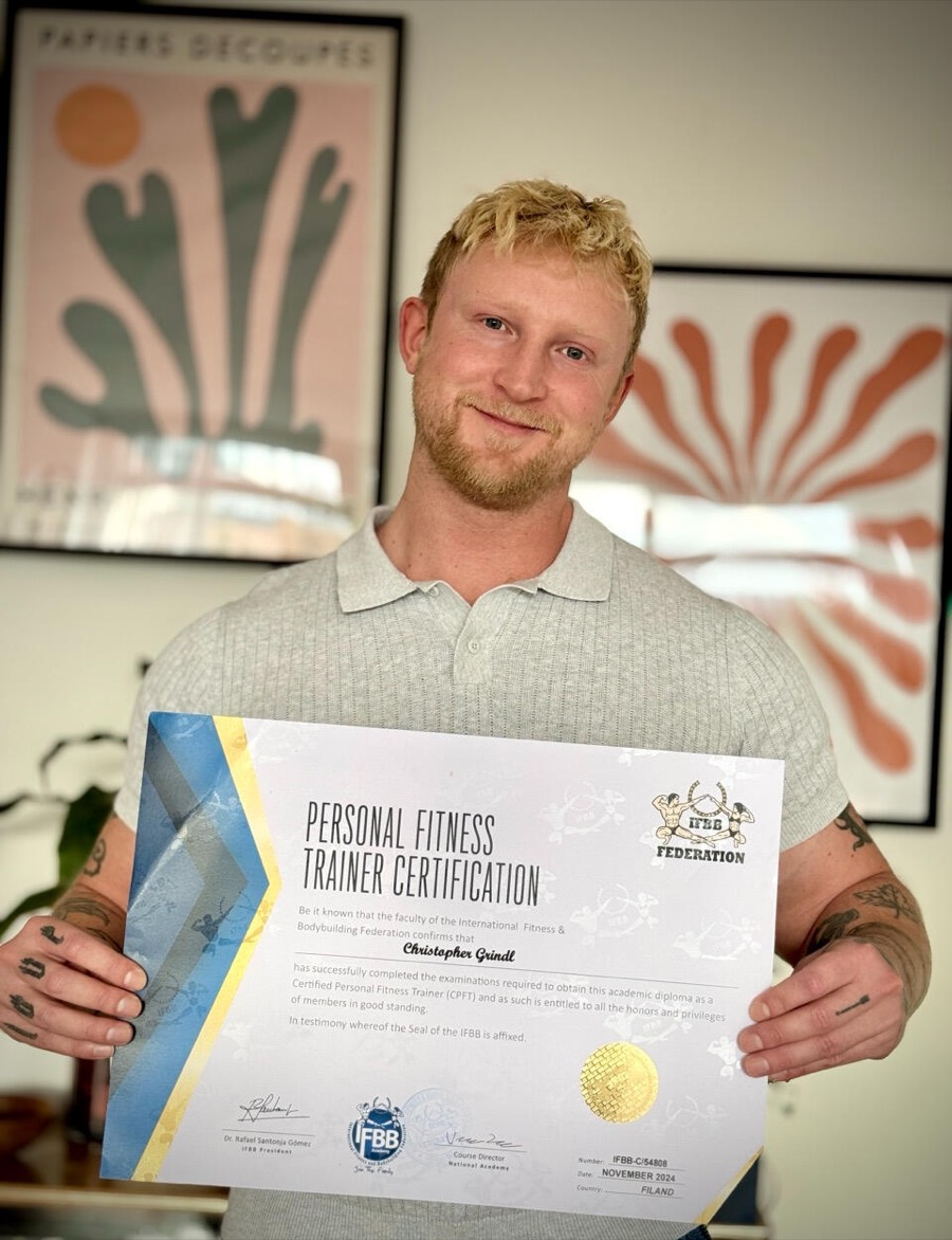 Chris Grindl with the IFBB Personal Fitness Trainer certificate
